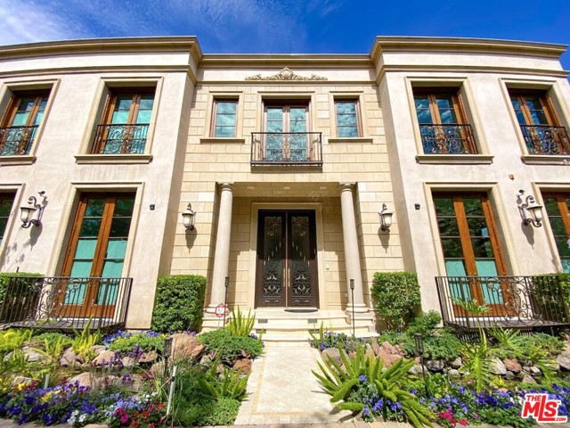622 N Rodeo Drive Beverly Hills, California Located on the world-renowned Rodeo Drive in the prestigious flats of Beverly Hills, this elegant home was designed with the utmost attention to detail and quality with gorgeous finishes, open floor plan, captivating formal entryway, and gorgeous custom skylight above the beautiful curved stairwell. This exquisite residence features an opulent living room, captivating dining room, family room with bar, and chefs kitchen with top-of-the-line appliances. The open and airy floor plan is perfect for indoor-outdoor living with French doors leading to the lavish backyard and lush pool. This rare gem in the flats is located within walking distance to all the shops and restaurants that the Beverly Hills Golden Triangle has to offer.