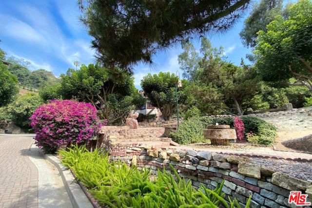 2131 Lyric Avenue Los Angeles, California LOS ANGELES ULTIMATE TROPHY INCOME PROPERTY with boundless creative income potential. 5 SEPARATE HOMES on a 2.5+ ACRE lot. An extraordinary rare Los Feliz authentic COMPOUND. Parking for 14+ vehicles. Incredible income property set apart by architecture, history, size, privacy, nature, and pure beauty. A long gated private drive leads to this hideaway surrounded by tall trees and magical pathways leading to an oversized pool, redefining estate outdoor park-like space where dreams of separate, spacious single family home living become reality. The long history of celebrated tenancy adds to the undeniable allure and viability. Property includes Wine cellar, auxiliary buildings for Offices and Crafts, vintage outr kitchen, multiple fountains, multiple indoor/outdoor fireplaces. The creative potential is only limited to your imagination. With nature all around, you won't believe you're only minutes to Downtown. A owner/user dream come true. Property also listed as a Residential Property.