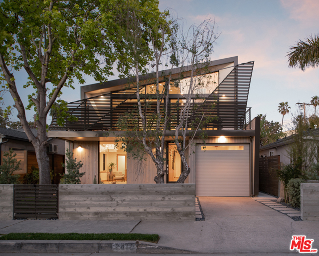 2412 Bryan Avenue Venice, California Step out of the ordinary with a newly built home in the coveted Silver Triangle. Elegantly crafted with a beautiful front facade, this home features four bedrooms, 3 baths, and 4 outdoor decks spread over two floors of artfully integrated indoor/outdoor living. A soaring second-floor living/dining space fronting an expansive hardwood deck makes the ideal space for relaxation and entertaining. The splendid main bedroom provides an elevated sanctuary, and an oversized front room (with en-suite bath and wine bar) on the first level can flexibly serve as a guest suite, media den, private office, or even a second living room. Outdoors, the large lot (300 SF bigger than typical), lush landscaping, and cul-de-sac-like street with no alley impart a tranquility rarely enjoyed in a property so close to the amenities (beach, Abbot Kinney, Marina parks) that make beach living special. With refined architectural detailing, high-end fixtures/appliances (Wolf/Subzero/Miele), and ample storage via an enclosed garage and a wealth of custom built-in oak cabinetry, this home by 10-19 Architecture will satisfy your artistic and your functional needs.