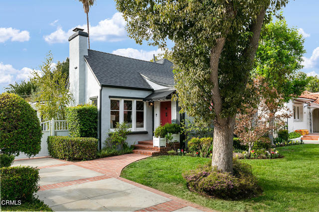 This classic 1925 English cottage is located on a beautiful tree-lined street in the desirable Caltech neighborhood. This three bedroom, two bathroom home comes with timeless elegance including hardwood flooring throughout, arched passageways, and leaded glass windows. The inviting front porch leads to the formal entry, which takes you into the living room. The bright living room is accentuated by coved ceilings, Batchelder fireplace and leaded glass windows. Adjacent to the living room is the formal dining room with large crystal chandelier and attached sunroom. The spacious kitchen has two pantries, charming breakfast area and a door out to the laundry area. From the primary suite, French doors open to a deck, patio and large grassy backyard. Attached to the garage is a 320 square foot studio that overlooks the backyard. Additional amenities include a new roof, central air conditioning, retrofitted fireplace and new water main line.