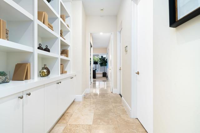 Hallway with built-in bookcases