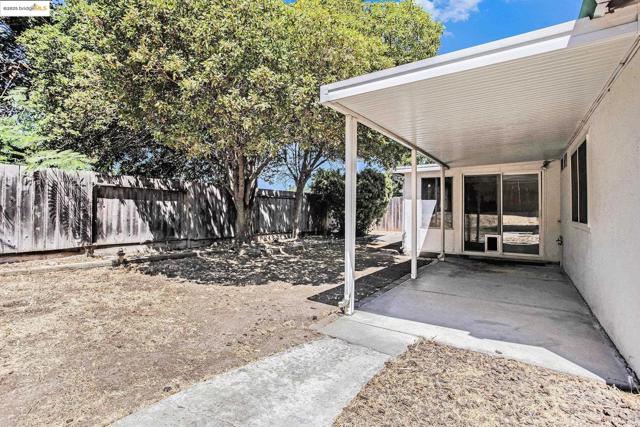 Fenced backyard featuring a patio area