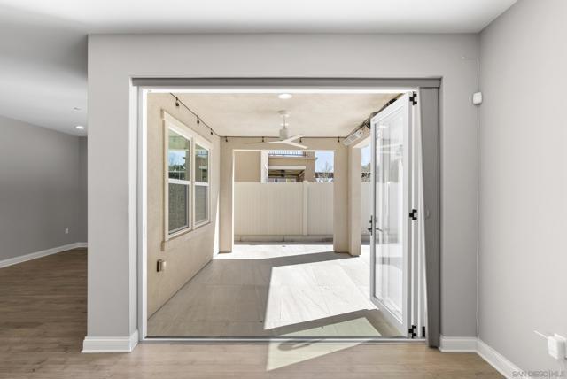 Patio/sunroom off the great room with vanishing door opening.