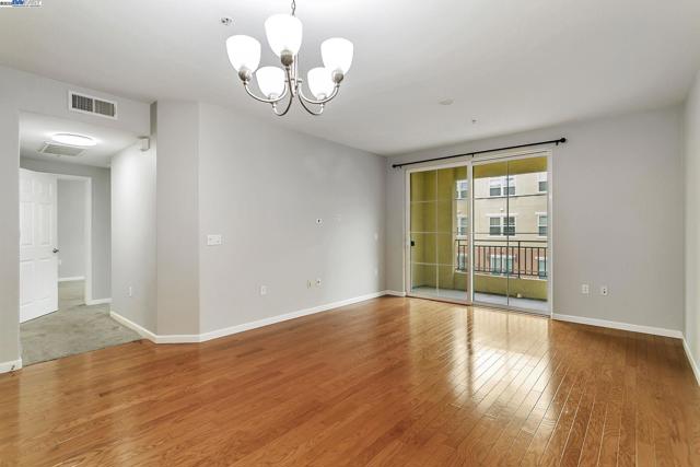 View of living and bedding areas from kitchen