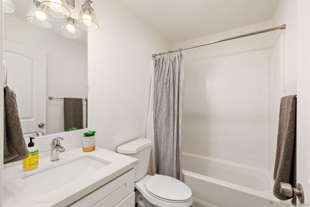 Virtually Staged - the 1st of 3 bathrooms.  This bathroom is on the main floor and it is a FULL bathroom.