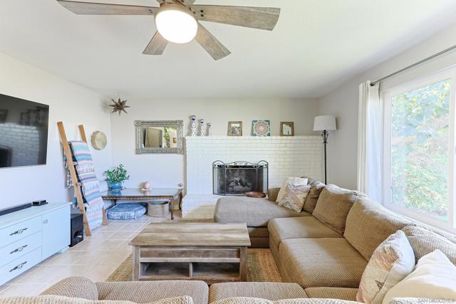 spacious living room with a custom pass-through into the dining room