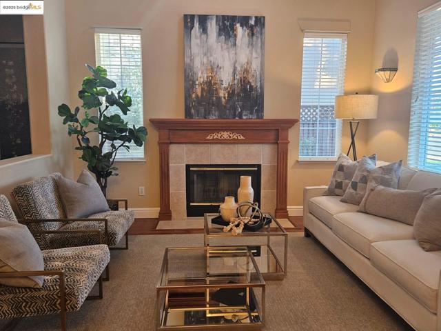 Living room featuring a fireplace and wood finished floors