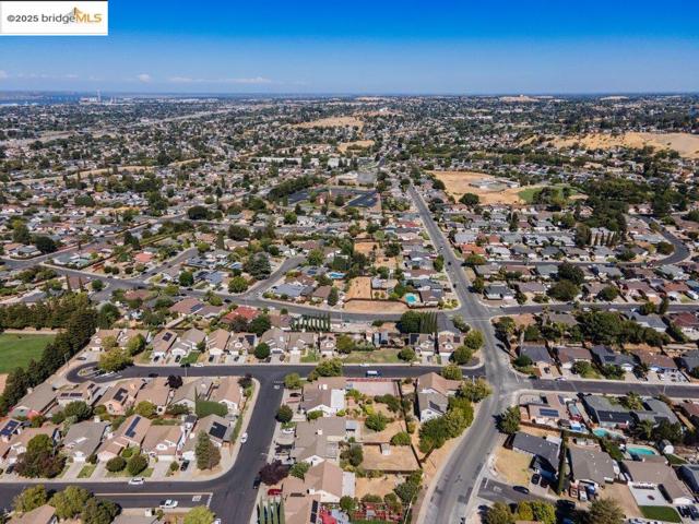 View of property location with nearby suburban area