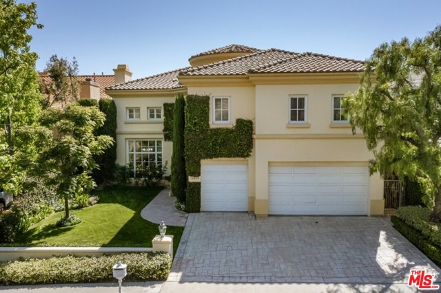 16676 Via Pacifica Pacific Palisades, California Warm and welcoming Villa-style home behind the gates of The Enclave. Large, open floor plan with soaring ceilings and ultra-high doors enjoys an entry foyer, formal living and dining rooms, an office with built-ins and a vast family/kitchen space with bar and breakfast areas. The lower level is completed by a butler's pantry, powder room, guest suite and 3-car garage. The upper level boasts one en suite, a jack & jill, and an incredible primary suite including two separate baths, a sitting area and a den/bonus room. Take in the serene mountain & ocean views from the balcony as well as the lovely yard comprised of grassy and patio spaces. Three wonderful Associations -- gated security with The Enclave ($466/mo), pool, tennis, basketball & more; with The Summit ($345/mo), and outdoor spaces with PDRA ($75/qtr). Please see DOCS for pre-inspection report. Seller does not know condition of chimneys and will not repair or give credits. Exclusions: some chandeliers, garage fridge & freezer, wall shelves.