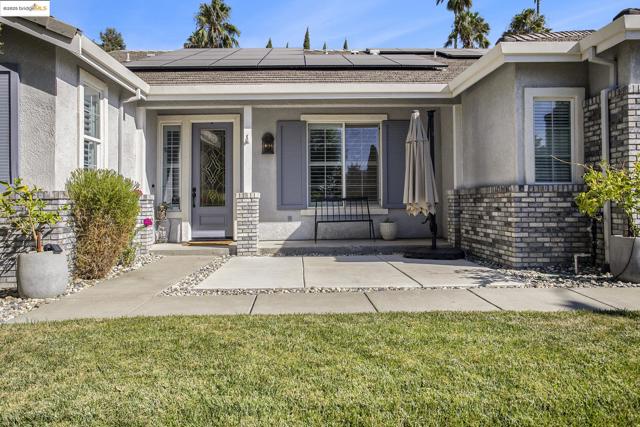 Beautiful glass door entry, and covered porch.