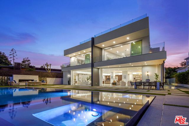 15205 De Pauw Street Pacific Palisades, California This stunning brand-new construction with ocean views is a California modern masterpiece in the heart of the Pacific Palisades! This gem is masterfully designed with natural light throughout the home and an abundance of outdoor living space. The home truly represents the quintessential California lifestyle. Notable design features include vaulted ceilings, skylights, rooftop deck, lower level with wine cellar, bar, screening room and an elevator. The home boasts an incredible master suite complete with a spacious bathroom including dual toilets, dual walk-in closets, and pocket doors that open up to your own balcony. Outside enjoy a private retreat with a pool, spa, BBQ and outdoor dining area, while enjoying the spectacular ocean view and the soon to be lavish George Wolfberg Park (at Potrero Canyon).