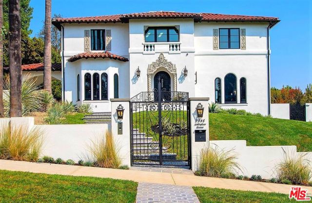 2340 Nottingham Avenue Los Angeles, California Beautifully re-imagined Mediterranean Revival, located on one of the most notable streets in Los Feliz. Meticulously restored and seamlessly expanded, this exquisite home blends original period details with todays modern amenities. The entry level includes a grand 2-story foyer, step-down living room, wood-paneled study, extraordinary kitchen with breakfast bar and banquet, media room, dining room, and powder bath. The 2nd level features a 900 sq ft master suite with expansive city views, vaulted ceilings and exposed beams, a separate sitting room with a dual fireplace, luxurious bathroom, walk-in closet, and private patio. Also included upstairs is an alcove reading area, 3 spacious bedrooms and Ann Sacks tiled bathrooms. The property goes on to include a large, detached guest house/ workspace with kitchen, bathroom, and unobstructed views. Separate cabana/gym with a pool bath. Landscaped grounds, sprawling backyard, pool, built-in BBQ, outdoor lounge and fireplace. A true must-see!