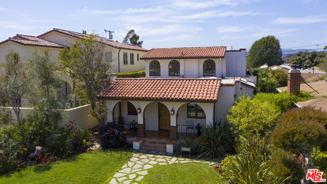 1017 Pine Street Santa Monica, California Beautifully appointed Spanish jewel located on one of Sunset Parks prime blocks. Expanded and remodeled with unparalleled craftsmanship and attention to detail. This one-of-a-kind home showcases arched French windows and doors, skylights, newly refinished walnut floors and Spanish style dramatic light fixtures. The large chef's kitchen has top of the line appliances, Bubinga hardwood island, Caesarstone counter tops, a beautiful tile backsplash, and thoughtful custom cabinetry that has everything right where you need it. Spacious dining room opens to the bright living room with wood burning fireplace complimenting the open plan great room. Two large bedrooms, a beautiful spa-like bathroom and an oversized laundry room complete the downstairs. A classic Spanish tile staircase leads you up to the master suite with a walk-in closet, built-in additional closet space, a luxurious bath, and the 4th bedroom. Entertain outside in style on the elegant patio looking out to the lush backyard. Offers due Tuesday 6/15/21@ 5:00PM