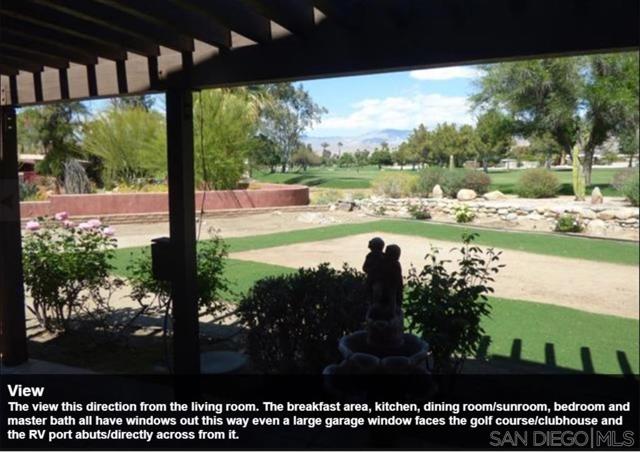 The view this direction from the living room. The breakfast area, kitchen, dining room/sunroom, bedroom and master bath all have windows out this way even a large garage window faces the golf course/clubhouse and the RV port abuts/directly across from it.