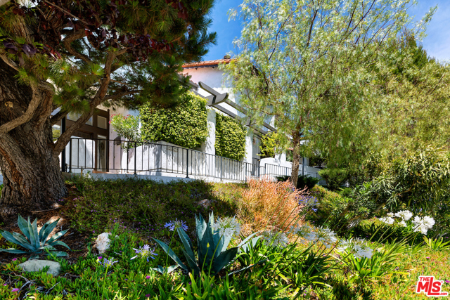 1543 Palisades Drive Pacific Palisades, California Welcome home to this beautiful Pacific Palisades Townhouse with sweeping Mountain views. This Michael Lane Villas unit faces Vereda de la Montura off of Palisades Drive. This is a three bedroom/three bath floor plan boasting almost 2,100 sq ft of expansive living space. Soaring ceilings greet you upon entry to a spacious living room with fireplace and glass sliding doors accessing the quaint brick front patio. The kitchen is nicely updated with granite counter tops and stainless steel appliances and you can enjoy mountain views from your kitchen and breakfast nook windows. The dining room looks over the main living room creating a wide open feel perfect for entertaining. All three bedrooms and two full baths are upstairs, including a master suite with fireplace, master bath, and private balcony with views. Very easy access to your private two car garage from Michael Lane and you're home!