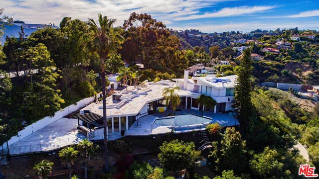 960 Stradella Road Los Angeles, California PRICED TO SELL!! LOCATION, LOCATION, LOCATION!! BEST DEVELOPMENT VALUE IN BEL AIR!! This premier development site sits across the street from "The One" making this the most exciting 2+ acre Bel Air location! Completely private, with panoramic city/canyon views, down a gated drive with motor-court, on a 79,722 sq ft lot, this estate property offers endless possibilities! ROUGHLY 18,000 SQ FEET CAN BE BUILT ON THE FLAT PAD OF THE PROPERTY, concept plans for this exist from Brandon Architects offering 240 degree views from the master, kitchen and living area. Additionally the original expired RTI plans to build 40,000 sq feet could likely be renewed with the city or the existing house could be expanded and upgraded.