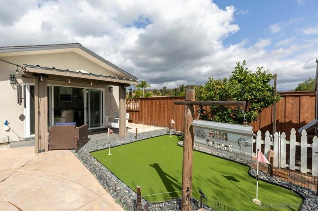 Backyard with putting green and view of ADU