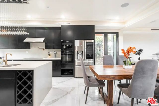 The french doors conveniently lead outside, near the side doors or the washer and dryer.