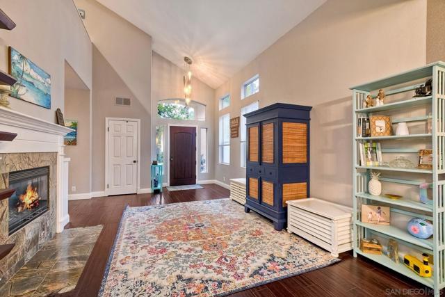 Featuring engineered bamboo flooring and a gas, dual-sided fireplace, this is a wonderful living room space.