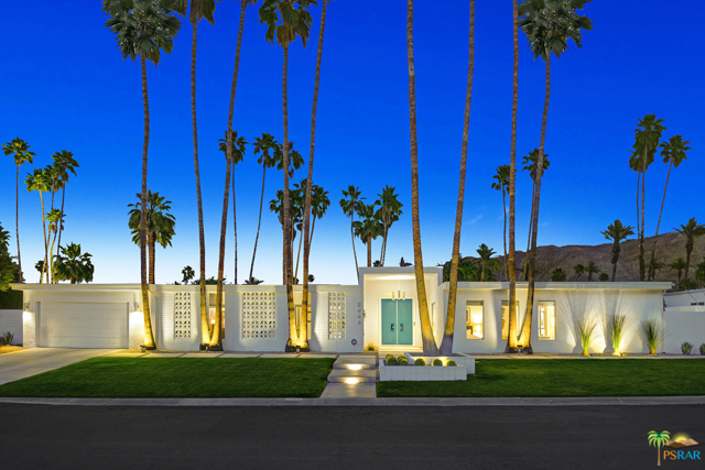 2444 S Alhambra Drive Palm Springs, California Situated on one of Indian Canyons most coveted streets, 2444 S Alhambra Dr, otherwise titled 25 Palms is poised as the ultimate statement of every luxury Palm Springs offers. This exquisite midcentury estate underwent a top-to-bottom restoration by Thomboy Properties. Sold furnished, it has only been further enhanced by the superior taste levels of its current owners. Designed to reflect what has made Palm Springs an international destination for those seeking a taste of glamour, luxury, and retreat; this home lacks nothing. Offering over 4,200 SF of living space, the original fleur-de-lys breeze block sets the perfect tone upon arrival. The floorplan, which contains 5 bedrooms (3 suites) and 4 bathrooms, offers an excellent balance of openness while maintaining a visually stimulating separation of spaces that makes hosting 2 or 200 a breeze. The main living space includes a gourmet kitchen with walnut cabinetry and Viking suite of appliances, formal dining, formal living, an expansive custom bar, and a stunning mid-century fireplace that separates the media room/den. All of these spaces open onto what is the ultimate Palm Springs back yard. Protected from the 18th fairway by a thick wall of ficus, a massive classic pool, key-hole hot tub, in-ground firepit, multiple lounge areas, and walls of breezeblock are surpassed in grandeur only by panoramic southwestern views of Mt. San Jacinto that will take your breath away. The master bedroom retreat offers a moment of solitude away for the homeowner with its expansive sitting area, spa-like bathroom, and stunning Santa Rosa mountain views. Guests will also enjoy this same level of retreat in the attached, separate entry, casita with living area, kitchenette, and plush sleeping quarters. Whatever space you might choose to enjoy at 25 Palms, you will quickly realize that you now have can call home what is truly the embodiment of everything the world loves about Palm Springs. This home is poised perfectly to be your next home-away-from-home or a super high yield luxury rental with projections nearing $300,000/yr in net income.