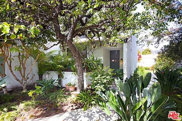 1566 Palisades Drive Pacific Palisades, California The true essence of living in the Highlands. Surrounded by nature, this UPDATED END-UNIT townhouse is both private & bright and offers an exceptional floorplan that promotes 'open-style living.' Cook in the large newly remodeled eat-in kitchen and relax in the adjoining family room with built-ins. A large formal dining room and a step-down living room with fireplace spills out to a serene bricked patio where birds sing for your outdoor pleasure. Upstairs are two-bedroom suites including a master with vaulted ceilings & balcony which makes you feel as if you are in a treehouse. Hardwood floors, recessed lights, plantation shutters & customized blinds, powder room, convenient upstairs laundry, a lemon tree and an X-large 2-car garage perfect for the home gym/yoga space complete this very special property. HOA has pool, spa, sauna, gym & tennis courts.