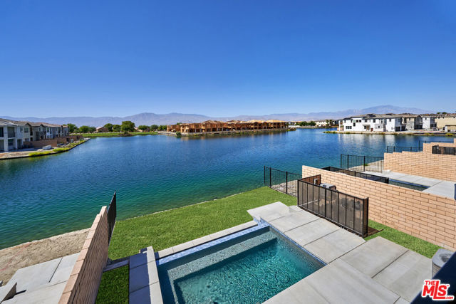 84653 Lago Breeza Indio, California Brand New Lake Front Home, best price on the Lake with over 80K in custom builder upgrades, in the guard gated community of Terra Lago, which allows STRs. Just completed and is located on one of the best view lots on the lake with head on, unobstructed views. This home would make a great short term rental income property or family home. 4 spacious bedrooms with 3 1/2 bath and an extra 5th bedroom possible conversion upstairs, upgrades including flooring, kitchen and bath tile as well as a builder upgraded infinity pool. This home is a smart home and is waiting for you to enjoy the beauty and serenity of the lake. This property would make a great 1031 exchange option and generate six figures for years to come. The home is vacant and easy to show. ********