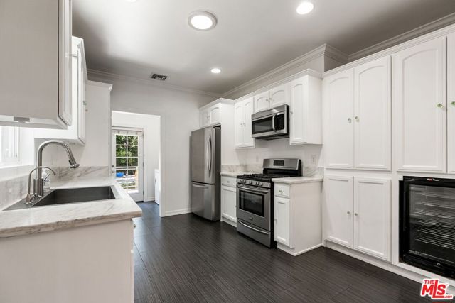 2130 W 27th Street, Los Angeles CA: https://media.crmls.org/mediaz/24e35f4f-1de2-41b4-820d-da5febf3ae6e.jpg