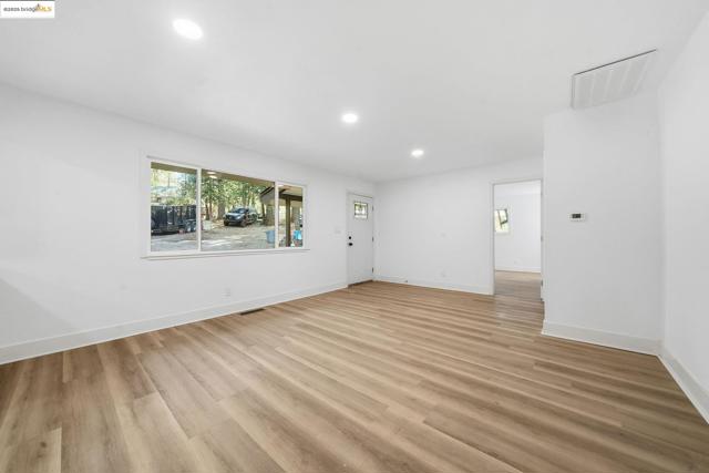 Unfurnished room featuring recessed lighting and light wood-style flooring