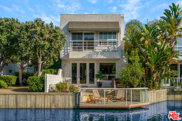 640 Harbor Street 1 Venice, California Welcome to your fully furnished personal paradise in the prestigious Del Rey Colony, a 24/7 guard-gated community offering tranquil lagoon views. Step into an expansive entertaining area that seamlessly flows into a secluded garden perfect for alfresco dining or unwinding in a hot tub with a lagoon backdrop. This elegantly remodeled residence boasts a gourmet kitchen complete with amazing built-in wine storage. Experience the future of home automation with a whole-house Sonos sound system and Lutron smart lighting. Indulge in luxury with an oversized steam shower, engage in a game of outdoor billiards, or immerse yourself in a cinematic experience with a state-of-the-art home theater featuring a 100-inch screen. Nestled in an architecturally acclaimed, award-winning community, Del Rey Colony also offers a hidden wildlife sanctuary surrounding the lagoon. Enjoy unparalleled privacy with round-the-clock security and a suite of amenities including a gym, pool, and spa. Conveniently located just minutes away from Venice Canals, Abbot Kinney shopping, and Erewhorn Market, as well as a variety of beaches and dining options.