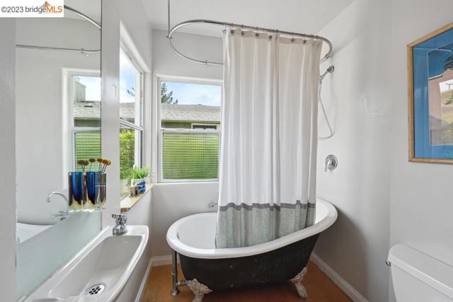 This compact bathroom features a clawfoot tub.