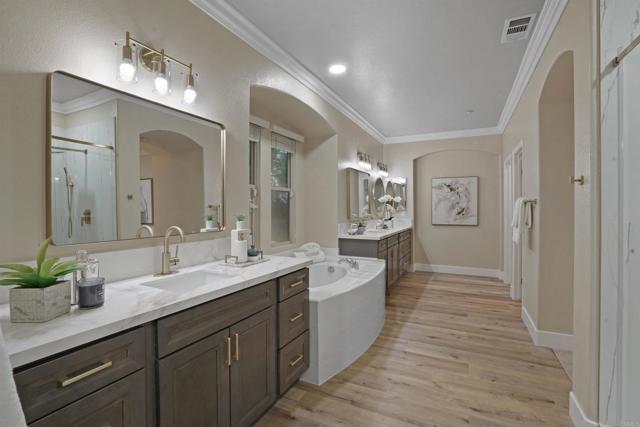 Remodeled and updated with new cabinets, counters, mirrors, hardware, sinks, toilet and flooring.