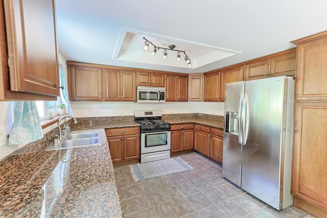 spacious kitchen with granite countertops