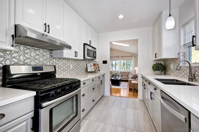 Beautiful Kitchen with Newer Appliances! Peek a boo view towards Huge Family Room!