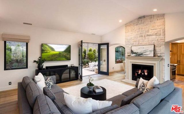 Cozy fireplace w/ doors to back garden