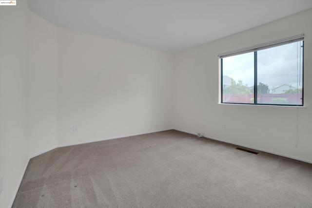 Unfurnished room featuring light colored carpet and baseboards