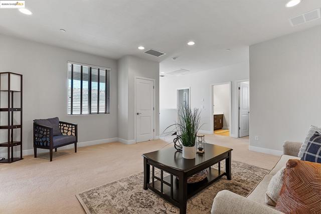 Living room featuring recessed lighting and light colored carpet