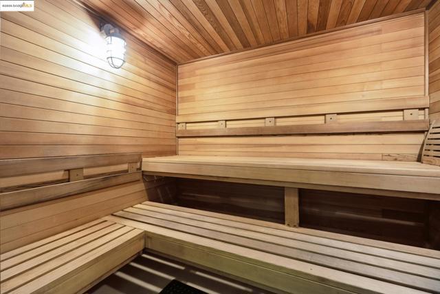 Sauna / steam room with wooden walls and wood ceiling