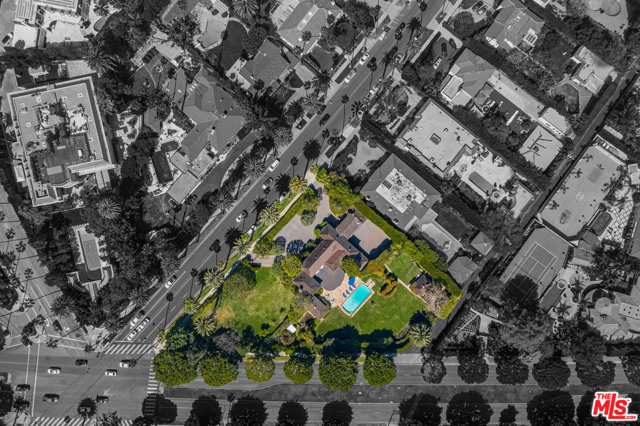 904 N Beverly Drive Beverly Hills, California HIGHLY coveted location. RARE development opportunity in the "Golden Triangle" and directly across from the iconic Beverly Hills Hotel! North of Sunset, gated residence. Close to world-renowned Rodeo drive restaurants and boutiques. PRIVACY, swimming pool, basketball court, spacious grounds, guest house. Property has its own backup generator. World-class location. An opportunity of this caliber has not been offered until now. Shown only to buyers with accepted offers.
