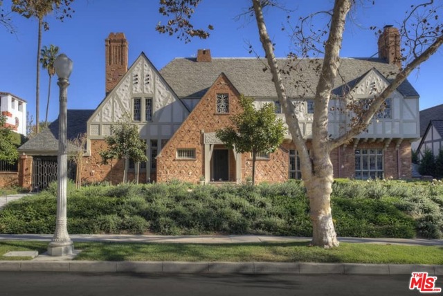 340 N June Street Los Angeles, California Stunning restored Classic English Tudor Estate by architect L.G. Scherer overlooking the golf course. Former home of Francis Ford Coppola and other Hollywood legends. Recent restoration by Tichnor & Thorpe with great attention to detail and original architectural elements. Dramatic 2 sty entry hall w/split staircase, large formal living rm with stenciled wood coffered ceilings, carved fireplace & stained glass. Wood paneled sunroom overlooking the gardens. Beautiful library w/fireplace Formal dining rm w/ original wood details. New gourmet kitchen/fam rm w/center island, custom cabinetry & marble slabs. French doors open to gardens & outdoor dining terraces. Master wing w/ large sitting room, dbl baths, high ceilings, fireplace, awning covered terrace & wonderful views. 3 additional family bdrms, one with large view terrace. Significant new gardens w/specimen trees, redesigned pool area and more.