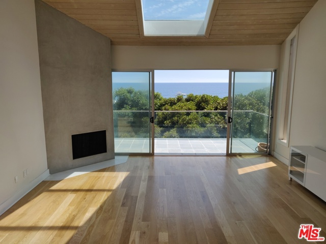 21352 Rambla Malibu, California Add some pizazz and change your lifestyle in this ultra-hip tri-level ocean view 2-bedroom town home located in the heart of Malibu. Amenities include an electronic skylight, loft office, Viking appliances, spa tub, French white oak floors, chic marble bathroom finishes, sleek fireplace, interior glass railing and glass enclosed patio. Don't miss the chance to Live the American Dream.