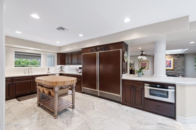 Kitchen looks into Family Room