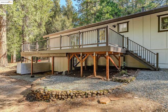 Back of house featuring a deck