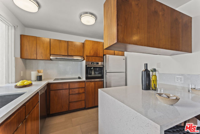 Kitchen looks out to living area