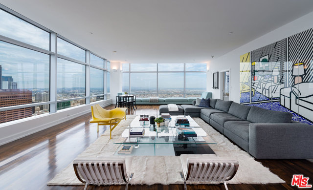900 W Olympic Boulevard 47G Los Angeles, California High above the bright lights of Los Angeles, this three-bedroom home in the Ritz-Carlton Residences at LA Live epitomizes sleek contemporary style in an effortless, elegant open floor plan.The work of acclaimed design and architecture firm Gensler, the 4,250-square-foot aerie is filled with eye-catching details, including stunning wood floors with a gorgeous patina, Snaidero cabinetry, and superior-caliber appliances from Gaggenau. Wraparound walls of glass offer views that sweep across the sparkling city skyline, and interior walls are ideal for the display of art. The master suite has an enviable vista and an impeccably outfitted walk-in closet. The Ritz-Carlton offers five-star amenities such as a rooftop pool with cabanas, a fully equipped fitness center, a spa and salon, an executive boardroom, a screening room, a residents lounge, and valet, housekeeping, and concierge services. LA Live hosts entertainment venues and clubs, 20 restaurants, and several globally celebrated events.