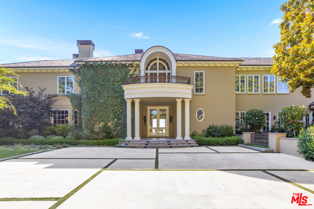 10 Beverly Parkway Beverly Hills, California Located behind the guarded gates of Beverly Park, the most prestigious and sought after Beverly Hills neighborhood, this immaculate Colonial estate boasts approx. 13,500 sqft of living space sited on ~2.03 beautiful acres. Offering extraordinary city sweeping views, the estate is composed of exceptional quality and design. The several living spaces include a chefs kitchen, great room, dining room, living room, opulent office, impressive theatre, fully equipped fitness center, steam room and sauna. The Master Bedroom with a spacious lounge area is complete with luxurious his and hers bathrooms and 2 large custom closets. There is an additional 5 bedrooms, several with ensuite bathrooms. Featuring large windows and doors, the interior spaces look out to the pristinely manicured gardens, sparkling pool, gazebo, outdoor kitchen and fountain making the perfect scene for entertaining as well as a relaxing escape.