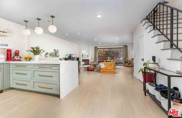 One-of-a-kind renovated designer townhome, with stunning open-concept kitchen and living space in prime Ocean Park, Santa Monica. The thoughtful floor-plan, modern finishes and natural light make for the perfect blend of style and function. Enjoy the ocean breeze in a tree-adorned peaceful private patio. Walking distance to the beach, parks and the finest of the Westside, as well as easy access to the 10 fwy. Rare small 6 unit building with a great community. Feels like a single-family home, with en suite bathrooms for each bedroom. Many stunning details you have to see. Your best Santa Monica lifestyle starts here.