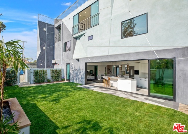 522 Venice Way Venice, California Brand new Modern construction, just blocks from Venice Beach with a fresh & unique Architectural design. This 3 level, 4 bed 4 bath townhome, featuring a rooftop deck w/city & mountain views, creates the perfect live & work environment at home. The first level features the bright & open main living/dining area w/fireplace, kitchen which features Premium Cosentino Silestone & Dekton countertops, Veneer Solid Maple cabinets, Miele Appliances, a Wine Bar w/Cooler. The indoor/outdoor flow opens to the spacious grassy backyard & patio w/BBQ to entertain. The second level features 2 bdrs & 2 baths, 2 covered balconies, & SXS laundry. The third level features the fabulous mstr bdr w/fireplace, spa-like bathroom, walk-in closet & additional bedroom/office w/ensuite bathroom. Direct access 2 car garage plus guest parking spot. Security on all floors plus exterior 6 camera system. Prime location in Silicon Beach close to Venice Canals & Beach Boardwalk, Abbot Kinney shops, restaurants & more!