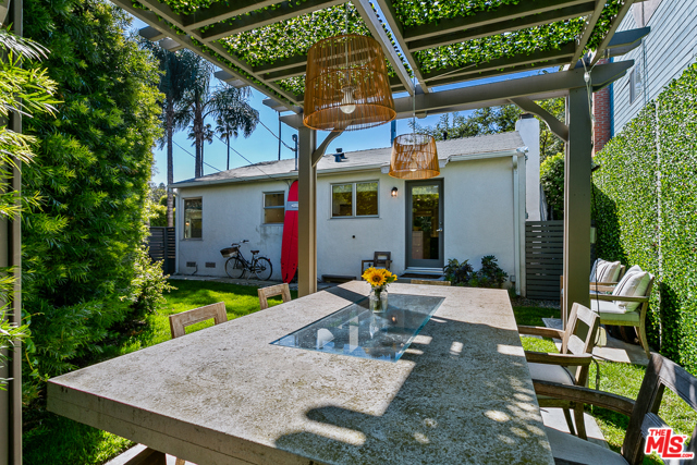 2432 Ocean Avenue Venice, California This classic Venice Beach bungalow was just extensively remodeled into a next-level retreat. Nestled next to the historic Venice Canals and Abbot Kinney Blvd, just blocks from the beach, yet privatized by lush and mature landscaping. Indoor/outdoor living is at its finest with a perfectly manicured wrap-around yard accenting a beachy outdoor dining area and soothing California gardens. Sun-kissed living spaces feature all new oak flooring, a stunning top-of-the-line kitchen, and a pristine bathroom. A beautifully finished garage is currently the most amazing work-from-home cottage. This is the best of beach living in an utterly exceptional property.