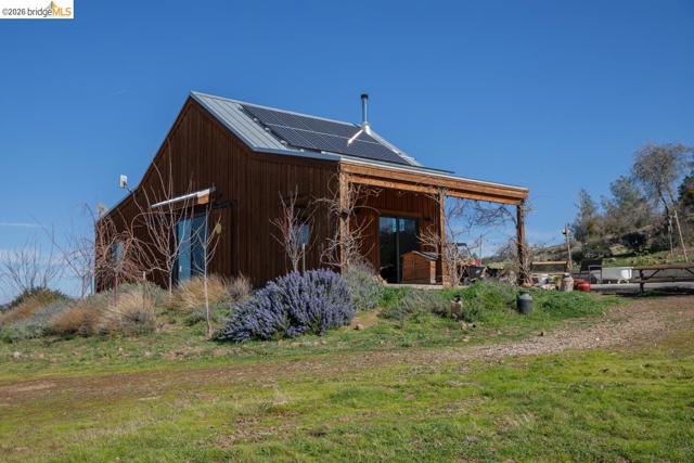 View of outdoor structure with solar panels
