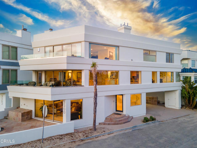 Hollywood Beach house, nestled just north of Malibu's and south of Santa Barbara's '8-figure' seaside homes. Spectacular 3-bedroom, 3.5-bath entertainers' home boasts 3,900 sq. ft. of luxurious seaside living, offering a one-of-a-kind corner graced with magnificent walls of windows, giving you the ultimate coastal vibe.  beach lifestyle is made effortless with convenient elevator access or you can choose to ascend the stairs with a stunning glass enclosure.  This home is its one-of-a-kind, oversized, corner lot that grants you breathtaking views of the Ocean, Islands, Harbor and Mountains. The ground floor is an oasis of relaxation, featuring a spacious guest bedroom and bathroom, a bonus family room (potentially convertible to a 4th bedroom) that opens up through a sectional glass slider to a slate patio area. Against a backdrop of coastal beauty, this space is perfect for family and friends, and provides a play/game area separate from the upstairs.  There is also an outside shower and on-site parking for up to 4 cars. Moving up to the second level, you'll find an entirely open and inviting space with travertine flooring that seamlessly exudes coastal elegance and blends the indoors with the outdoors. The kitchen is a chef's dream, equipped with top-of-the-line Viking stainless appliances, a Sub-Zero refrigerator, granite countertops, a breakfast bar, and a dining area.  An oversized family room with a gas fireplace and a wall-to-wall sectional glass slider opening to a generous-sized entertaining deck, ideal for alfresco dining.  Convenience continues on this level with a guest bathroom and a laundry room, making  life a breeze.   The third level, you'll discover the oversized master bedroom suite, complete with extraordinary ocean and channel views, a sitting area, a fireplace, a  walk-in closet, a wet bar and a refrigerator area. The luxurious master bathroom is a spa-like retreat, featuring double sinks,  a steam shower, a jetted tub, and granite counters, offering the ultimate in comfort and relaxation.  An additional guest bedroom and and  bedroom and bathroom on this level.  The expansive rooftop deck offers 360-degree views of the surrounding beauty, including the Channel Islands, and has a reinforced area for a jacuzzi. With an easy walk to the beach and harbor, your new  Beach home offers the best of coastal living. Embrace the breeze, the sound of waves crashing, and the stunning vistas that will make everyday life feel like a vacation.